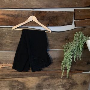 High waisted, triple button black skinnies